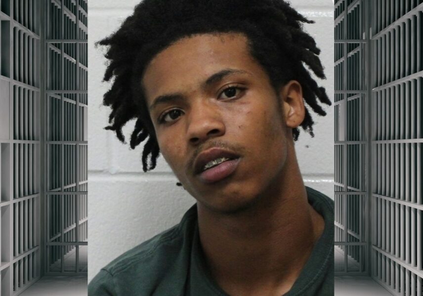 Young man portrait with prison bars background